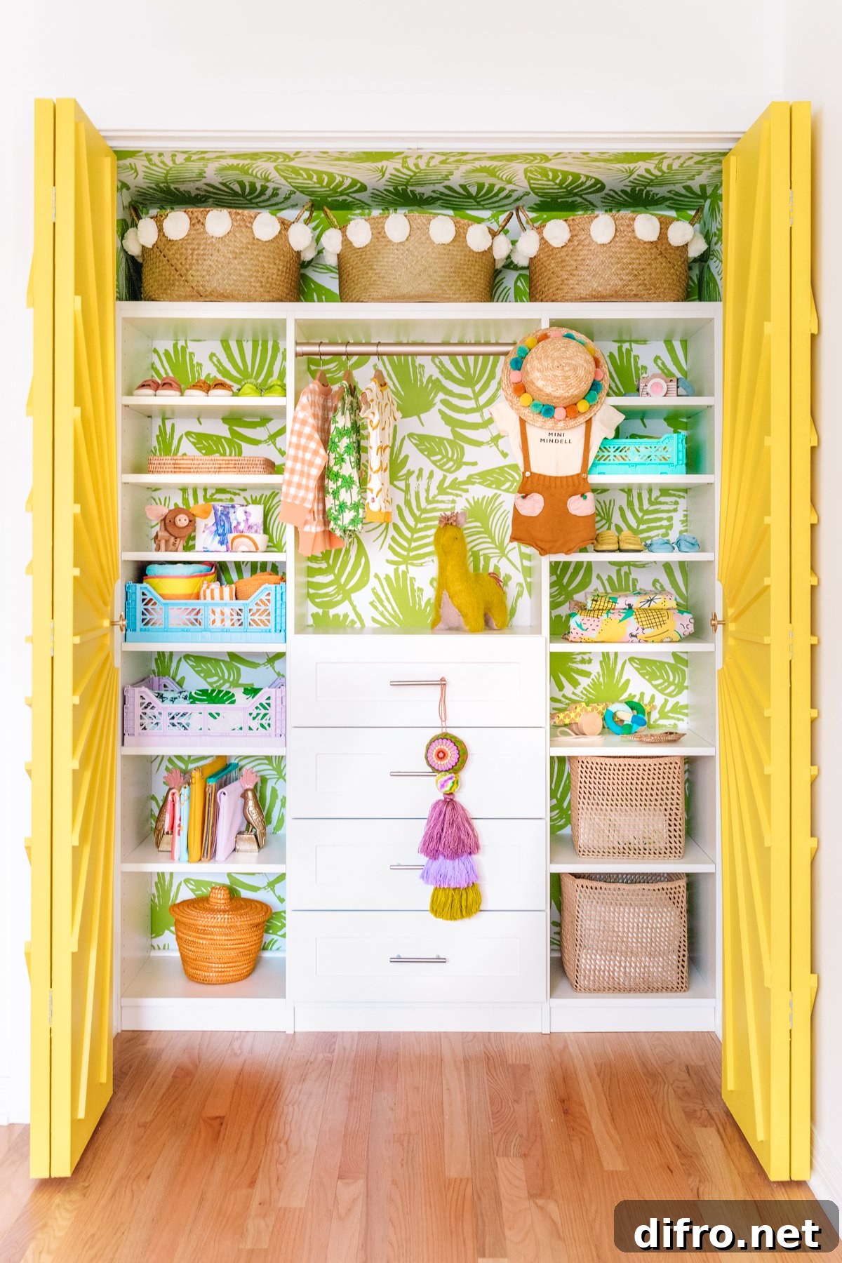 Nursery closet with tropical wallpaper