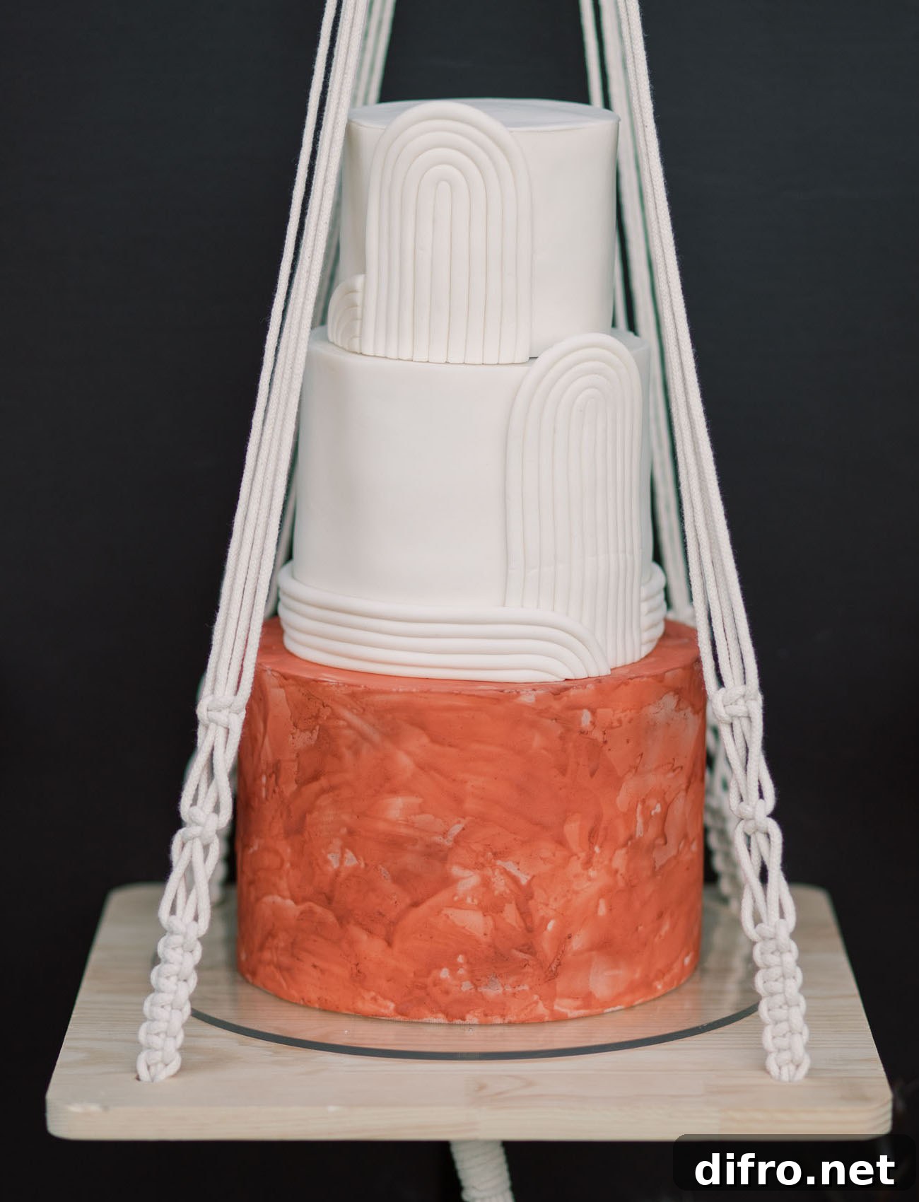 Modern wedding cake on a macrame hanger