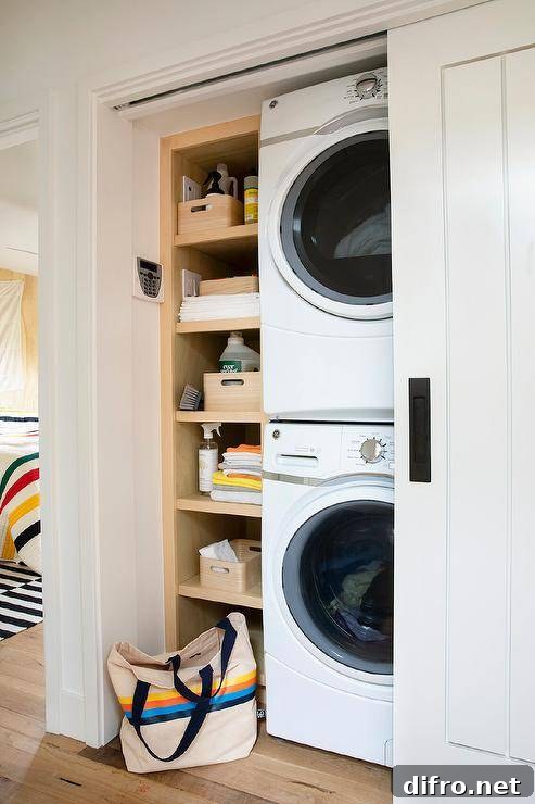 stacked laundry pair white hallway closet shelving beside bag on floor