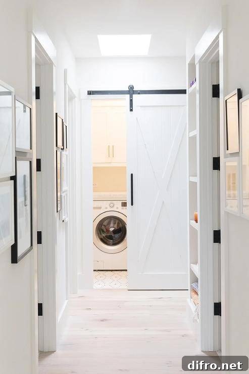 white laundry room sliding barn door hallway