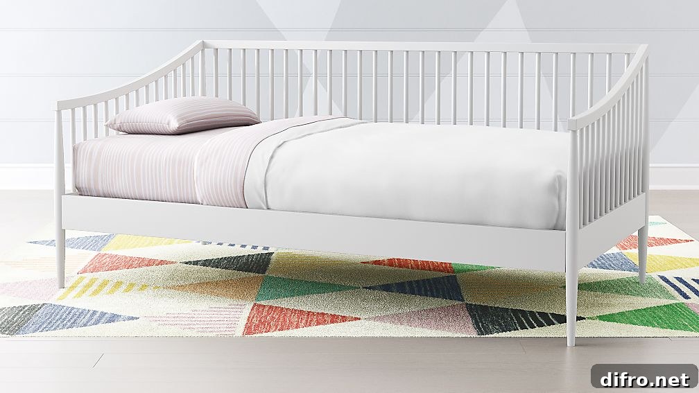 White spindle daybed for a child's room