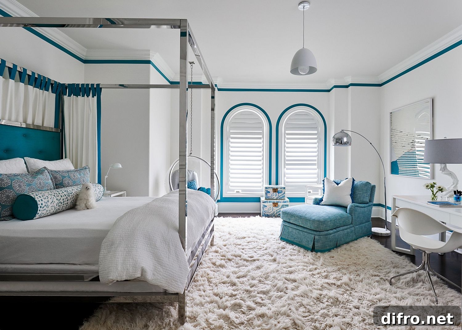 Bright blue accents in a white Mediterranean bedroom