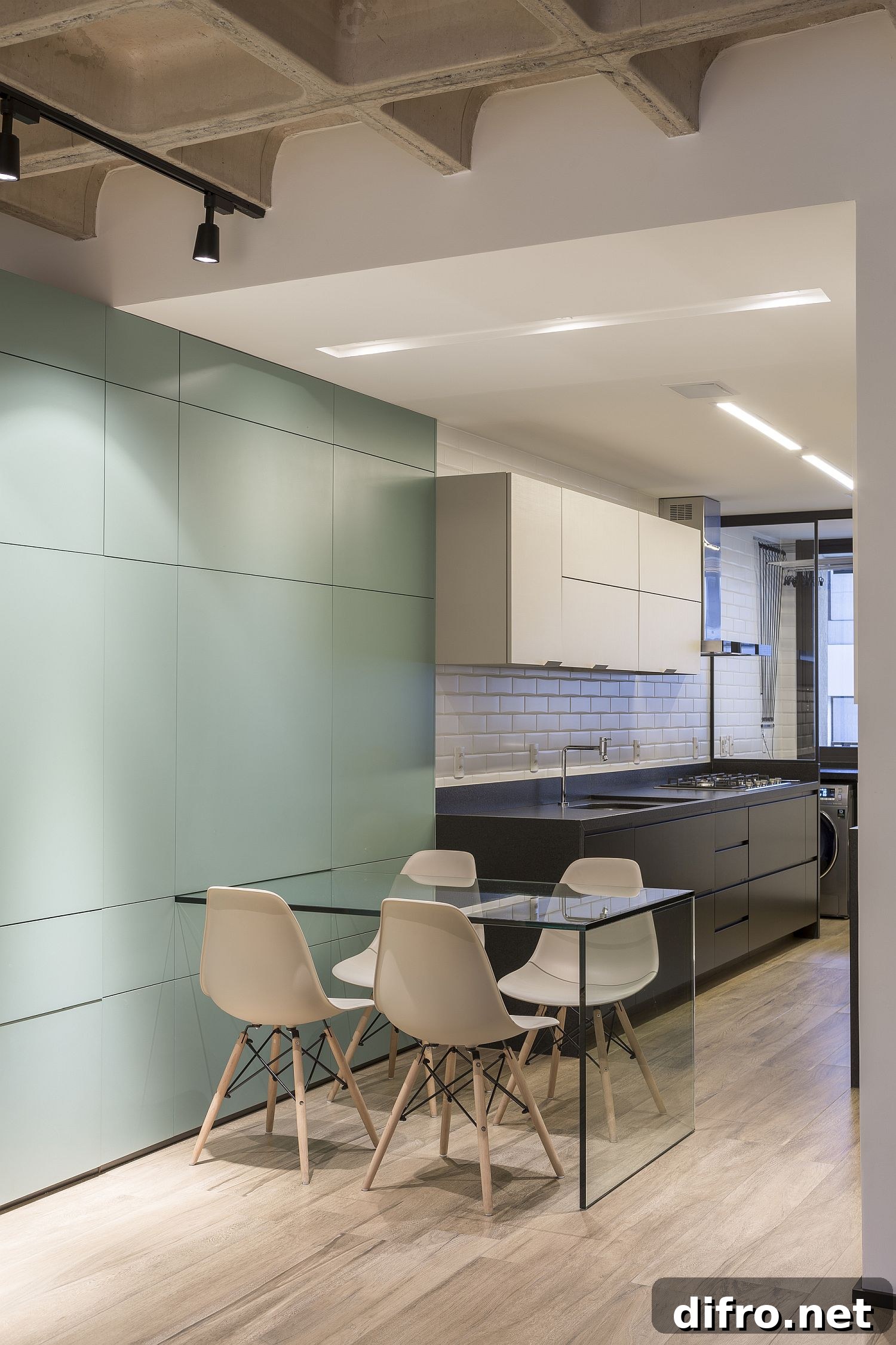 Pulling out the dining table from the multifunctional wall unit
