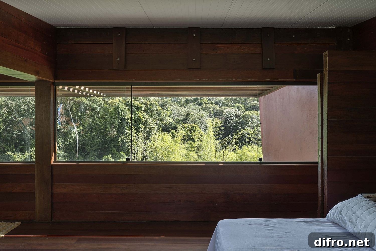 Bedroom with forest views