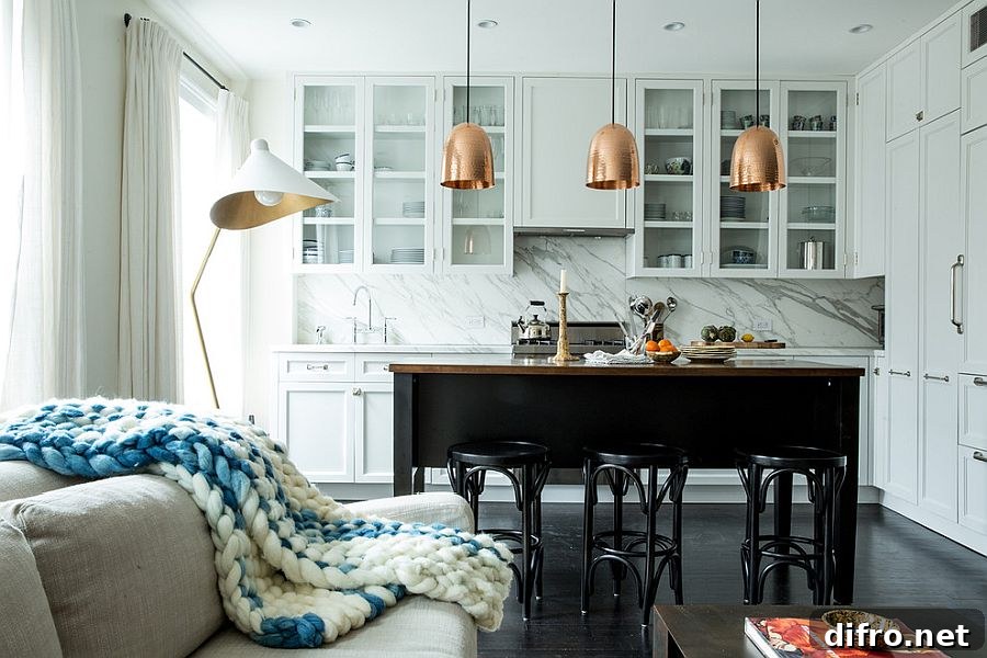 White kitchen with marble backsplash and metal pendants