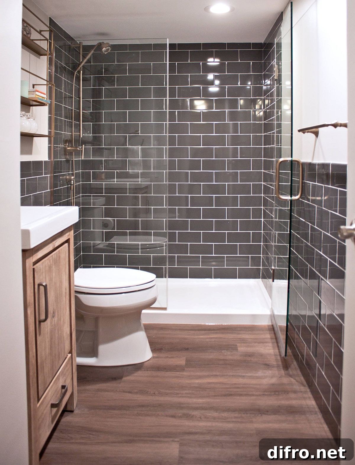 Small dark gray bathroom with wood floors.