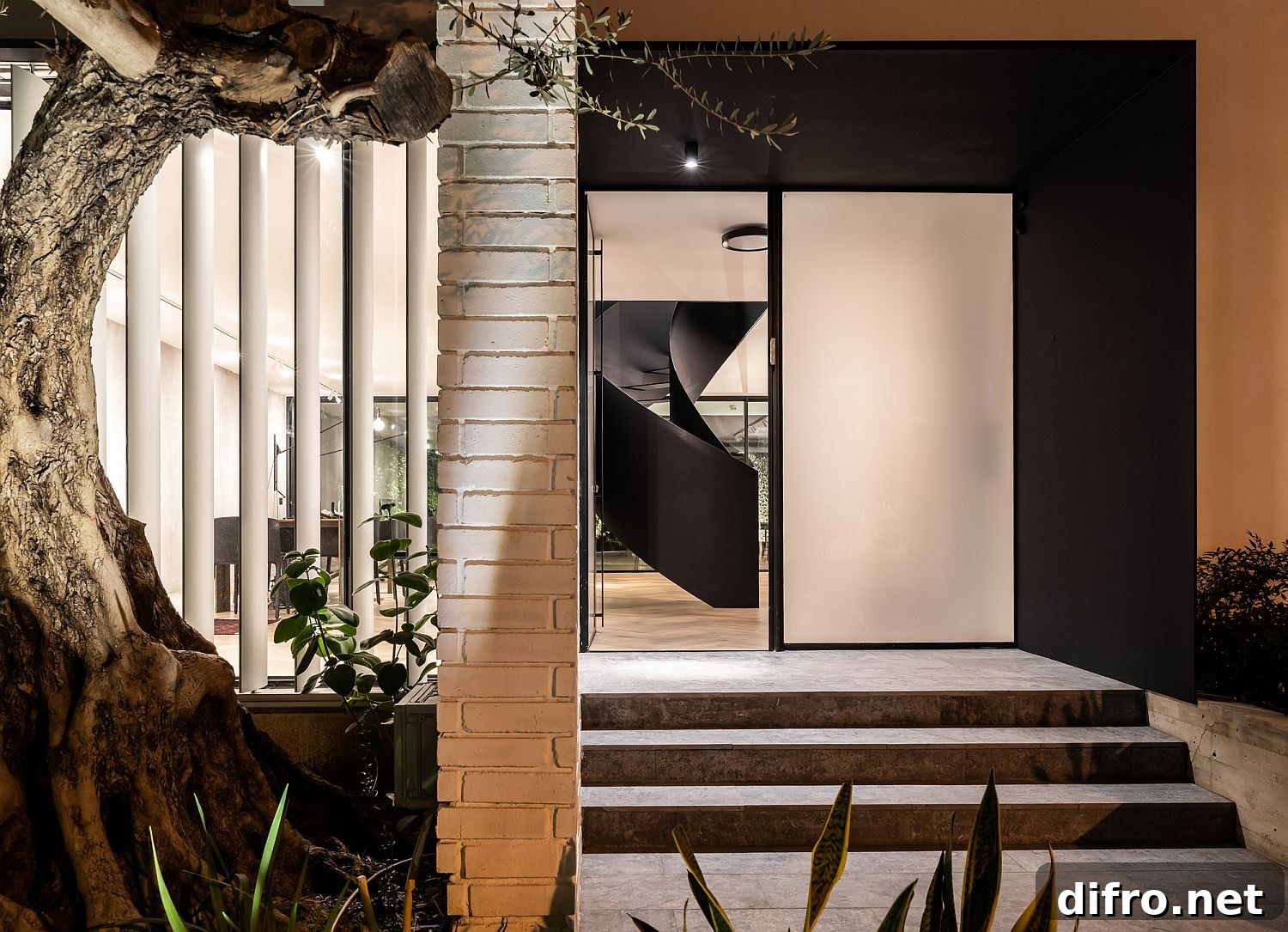 Acid glass walls and windows on the lower level provide privacy while bringing in natural light