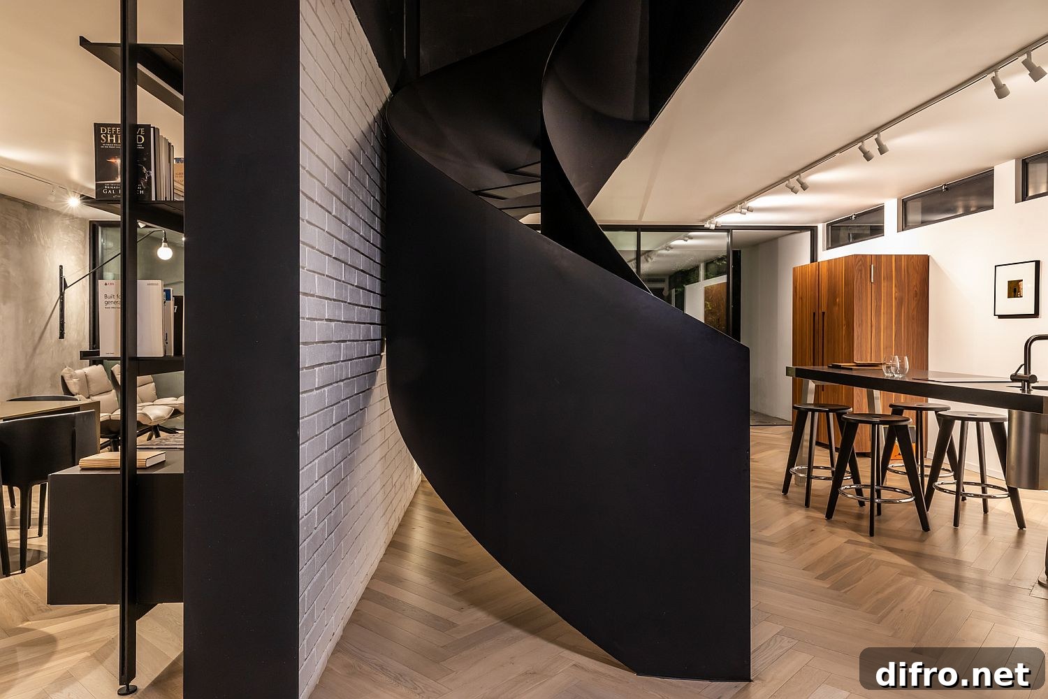Artistic spiral staircase in black steals the spotlight in the living area