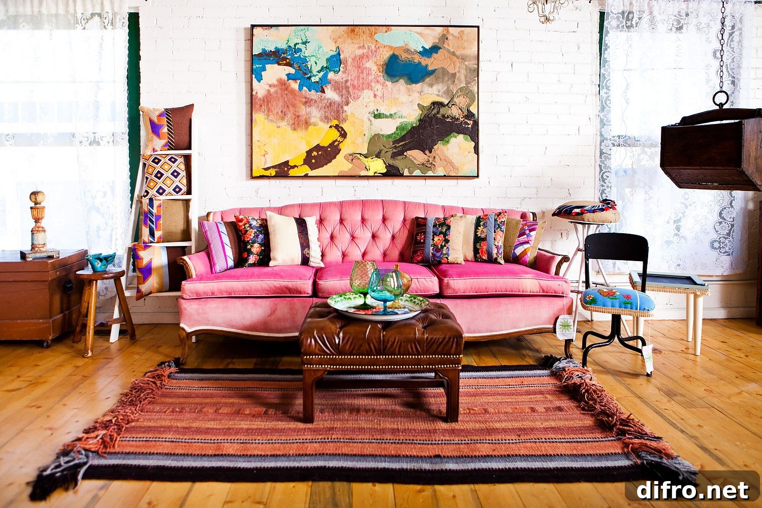 Fabulous pink sofa anchors this exquisite brick wall living room with eclectic style