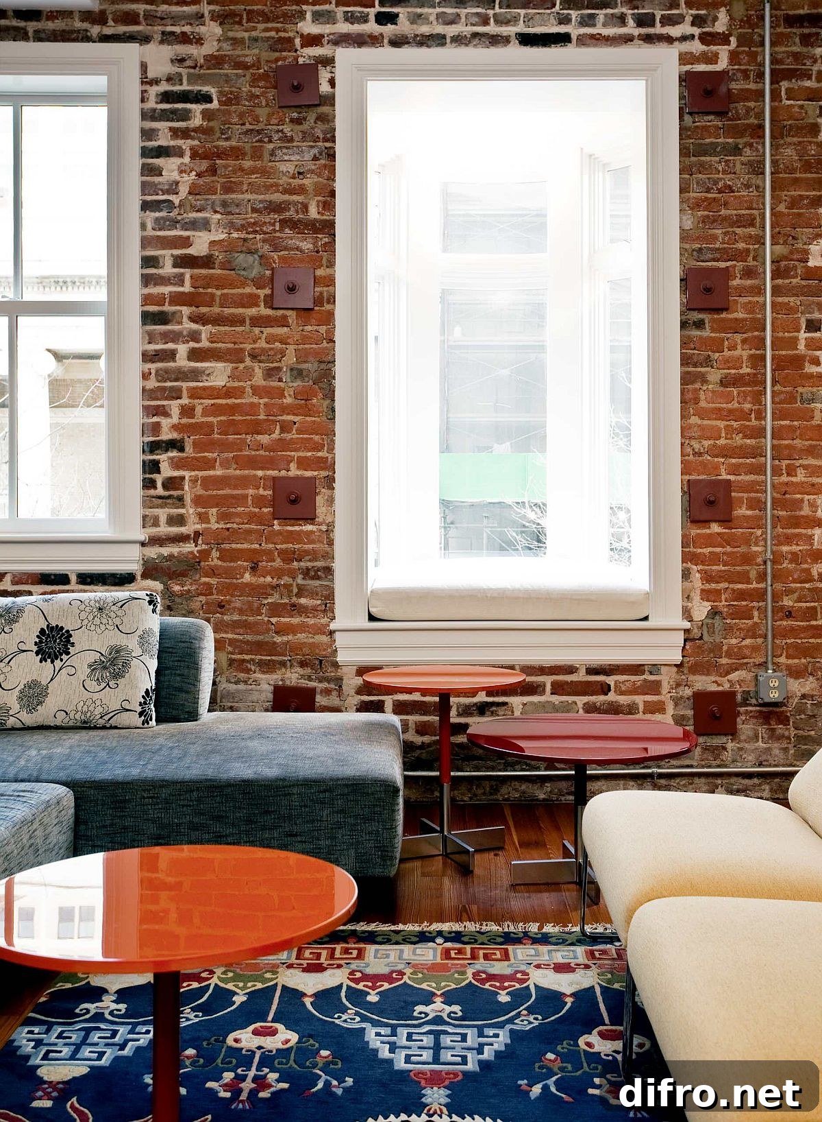 Multi-colored rug for the brick wall eclectic style living room with comfy décor