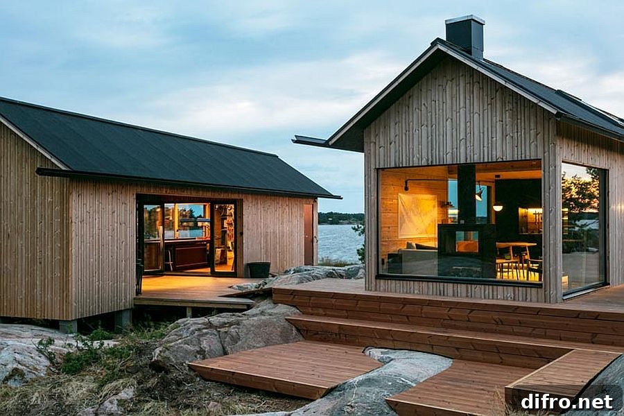 Cabins with dark roofs and light timber walls