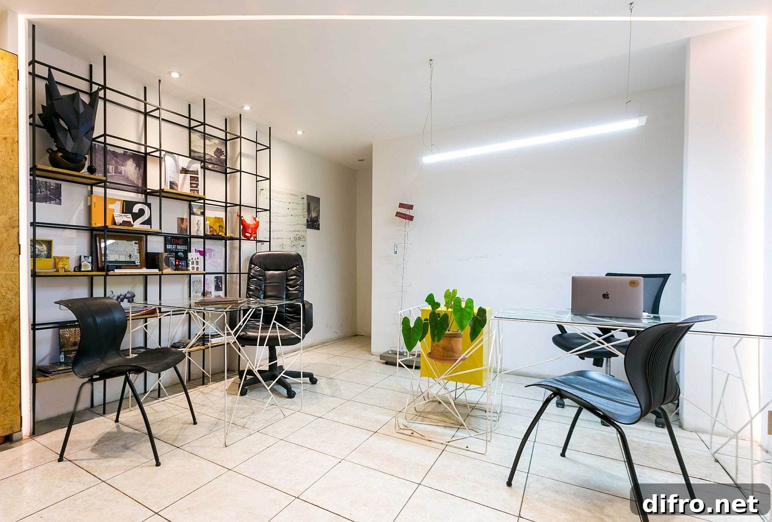 Metal frame shelf and colorful accents add industrial modern look to the small office