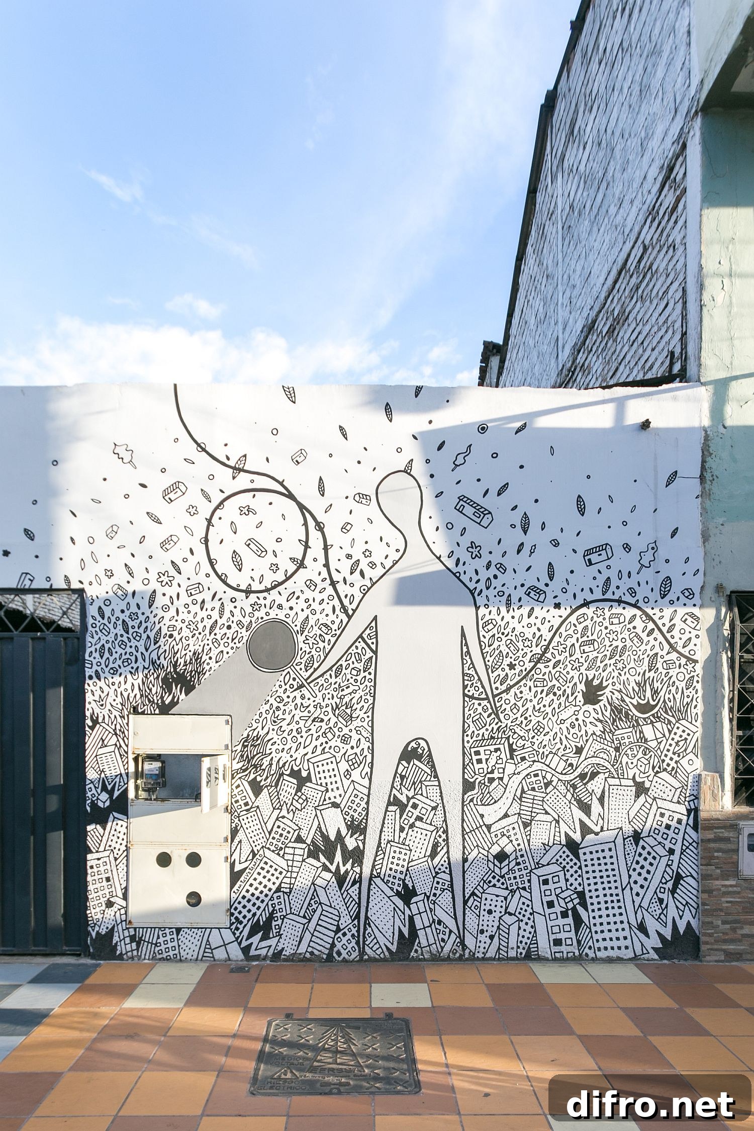 Beautiful wall mural by architect Carlos Valarezo graces the street facade of the office
