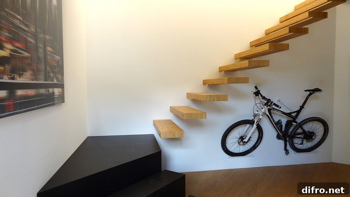 Stunning contemporary minimal staircase in wood connecting the lower box with the upper level