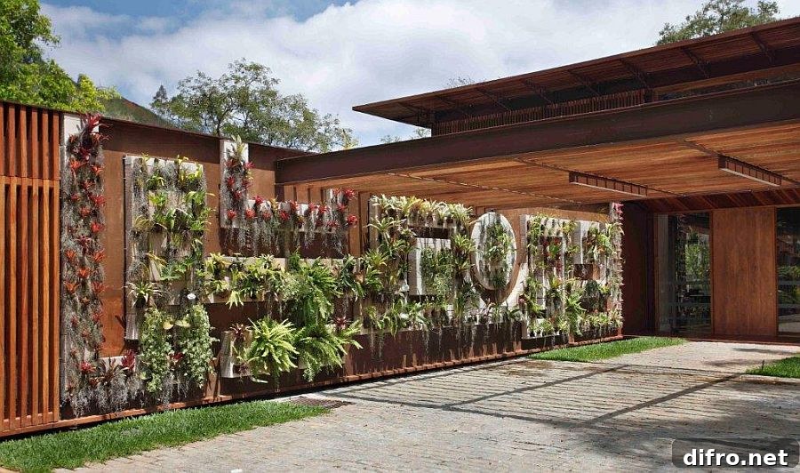Vertical garden and flowering plants bring an additional layer of greenery to the entrance