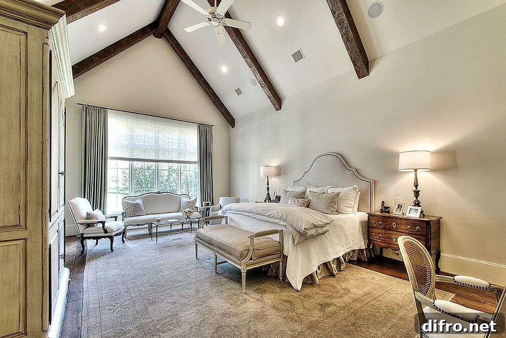 Structural wooden beams in a neutral bedroom for added charm