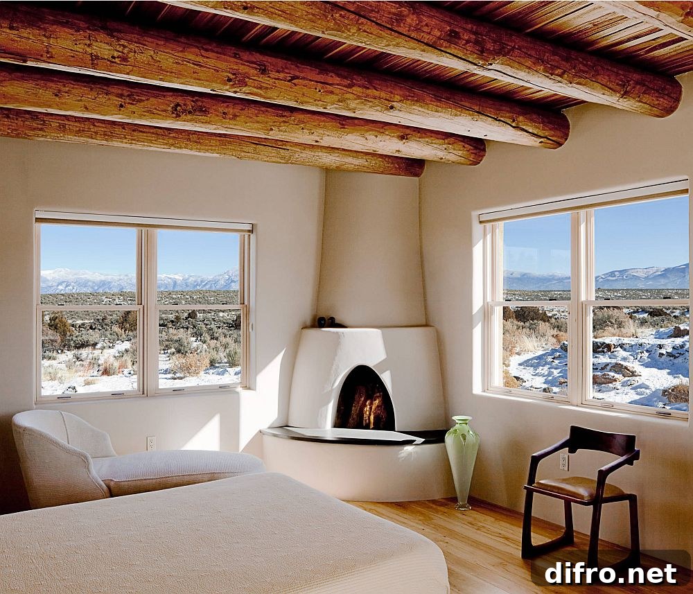 Cozy Mediterranean bedroom with log-style beams and fireplace
