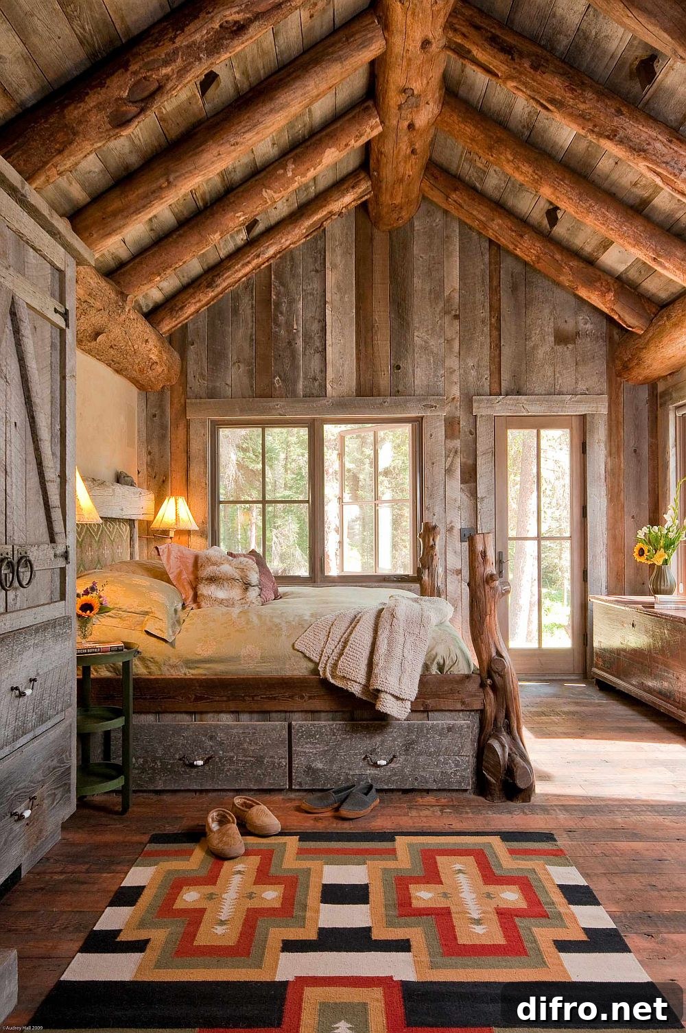 Double-height rustic bedroom with heavy log-like ceiling beams