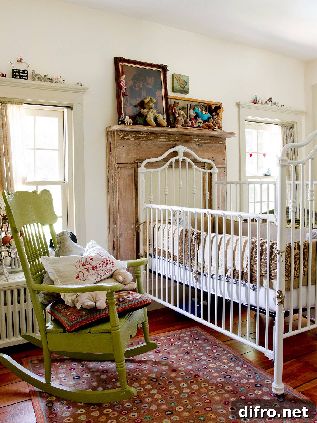 Green rocking chair in white nursery
