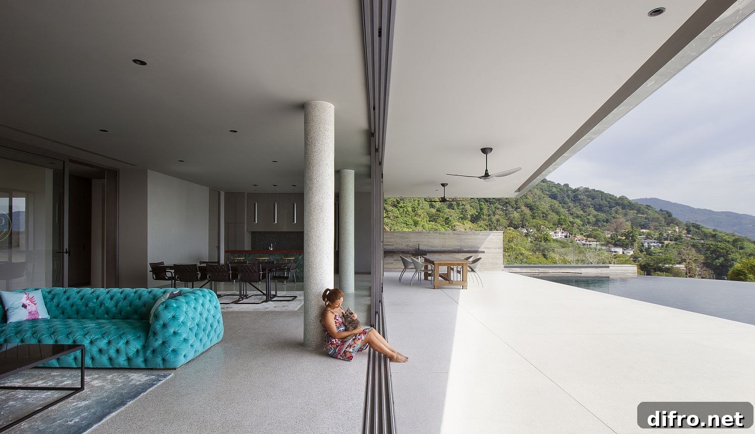 Sliding glass doors open to the deck and pool