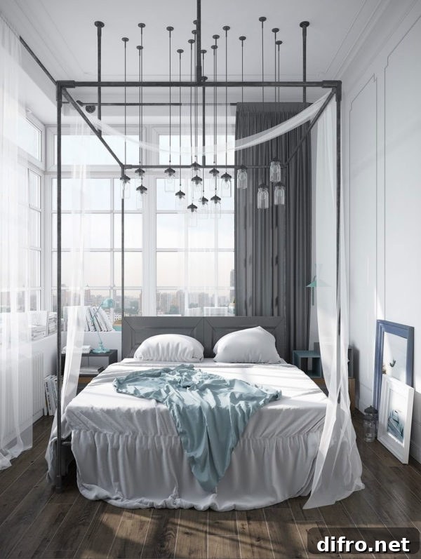 Black wrought-iron canopy bed with sheer curtains and chandelier lights