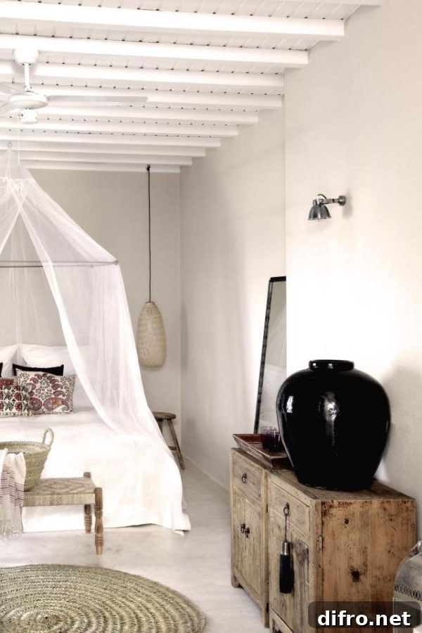 Rustic canopy bed with white draping