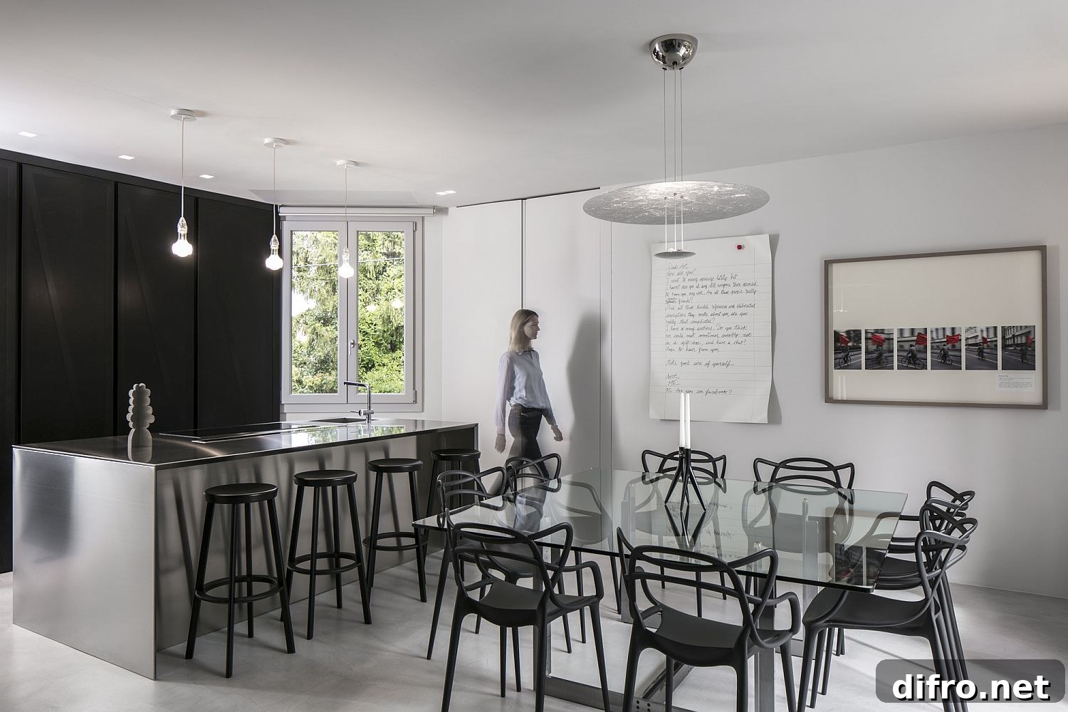 Open plan living area in shades of gray with black accents