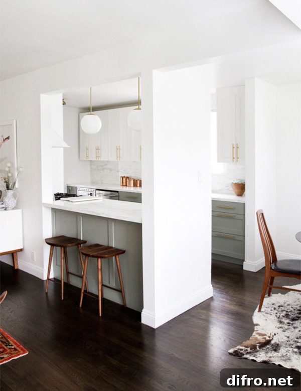 Light and bright contemporary galley kitchen with eating area and wood accents