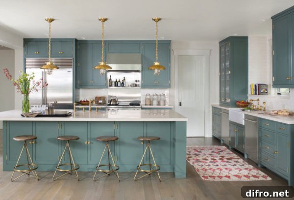 Colorful galley kitchen with third wall of cabinets and breakfast bar in green tones