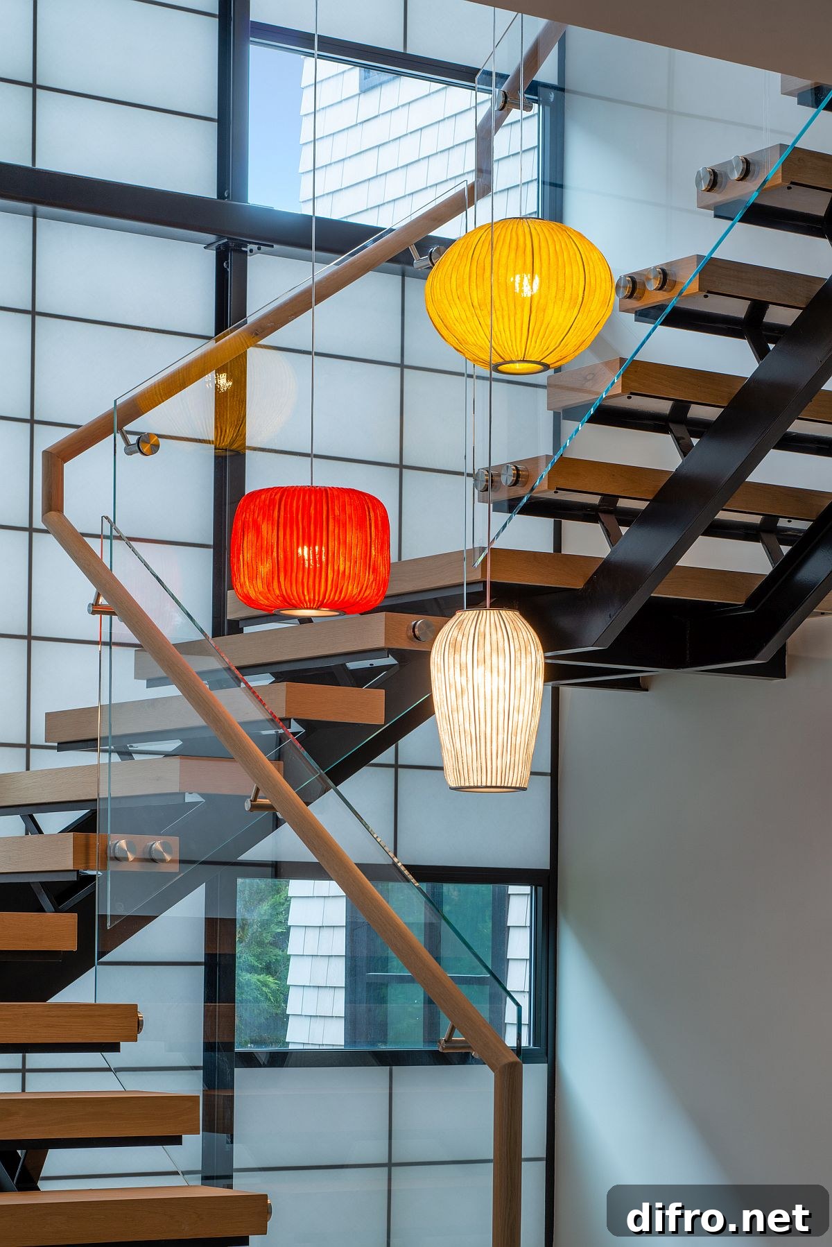 Multi-colored pendant lights for the staircase and its lightwell