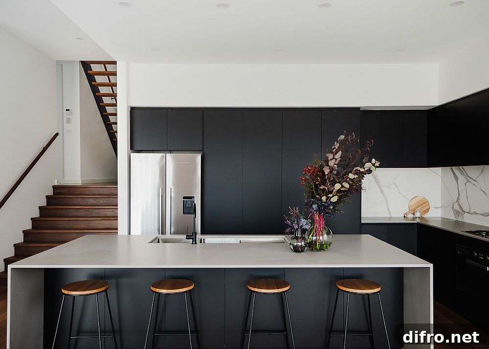 Slim black stools with marble backsplash