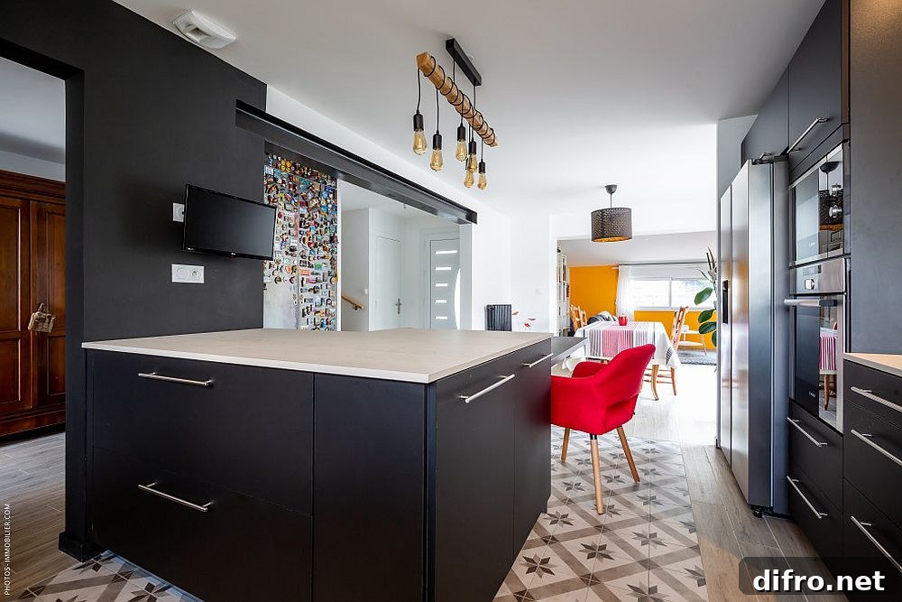 Edison bulb lighting in a modern black kitchen