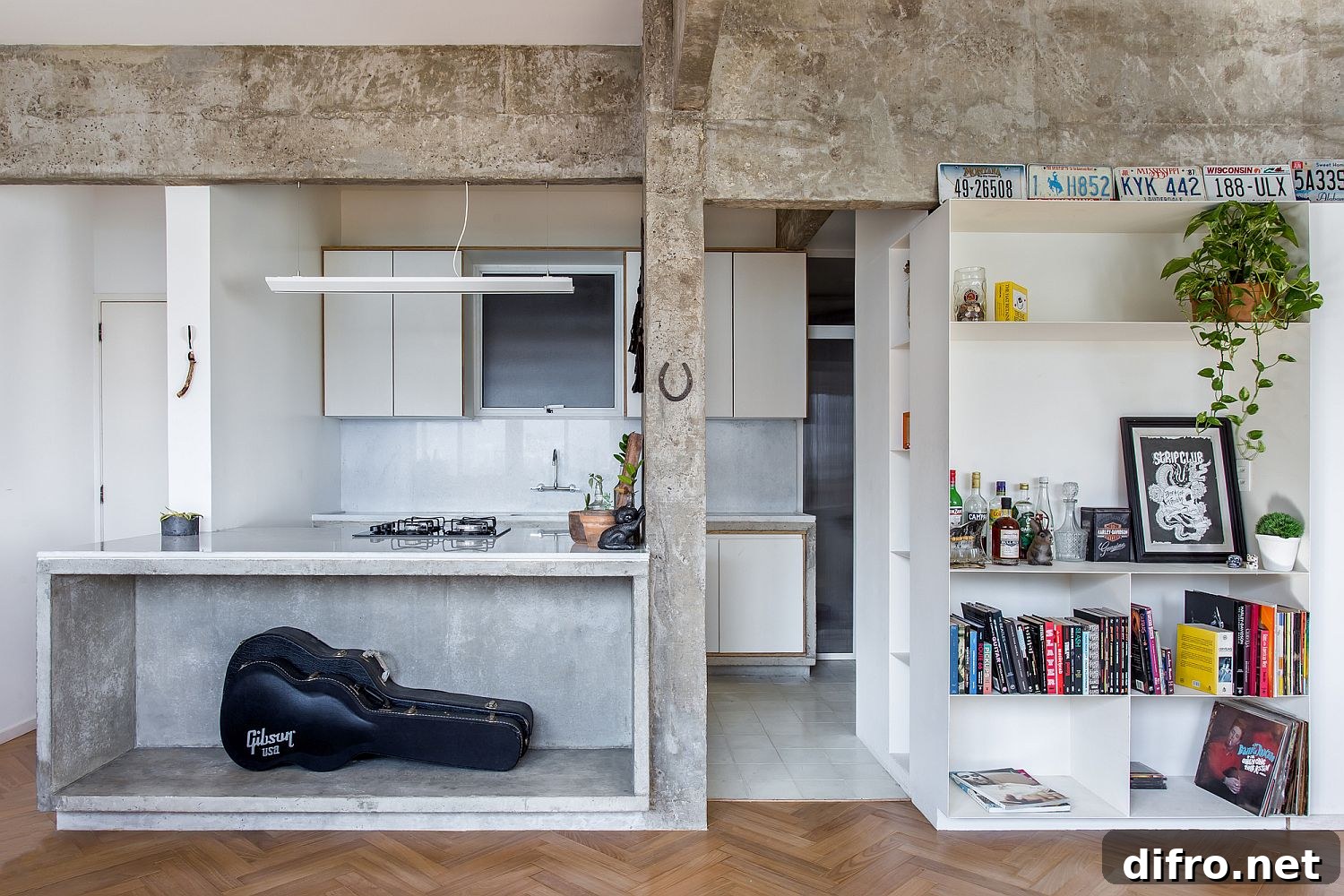 Concrete and wood living area with white shelves