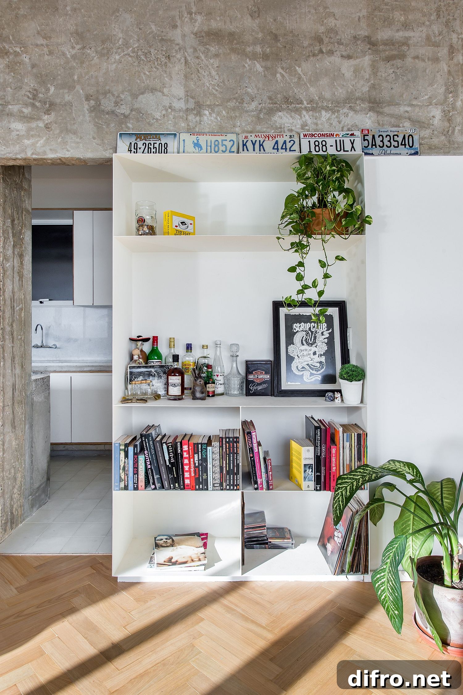 White shelf with decorative objects and plants