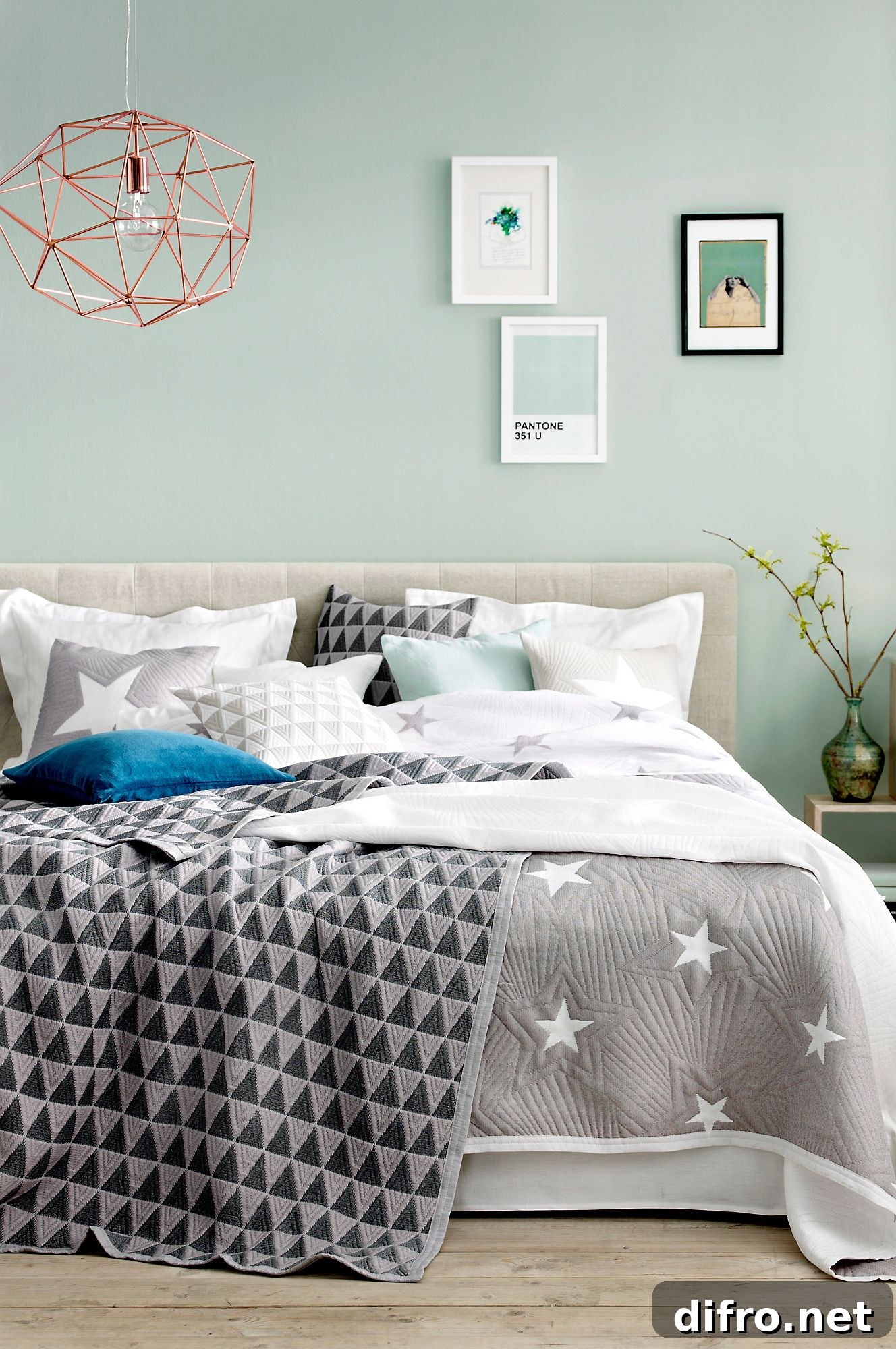 Modern mint green bedroom with graphic bedding