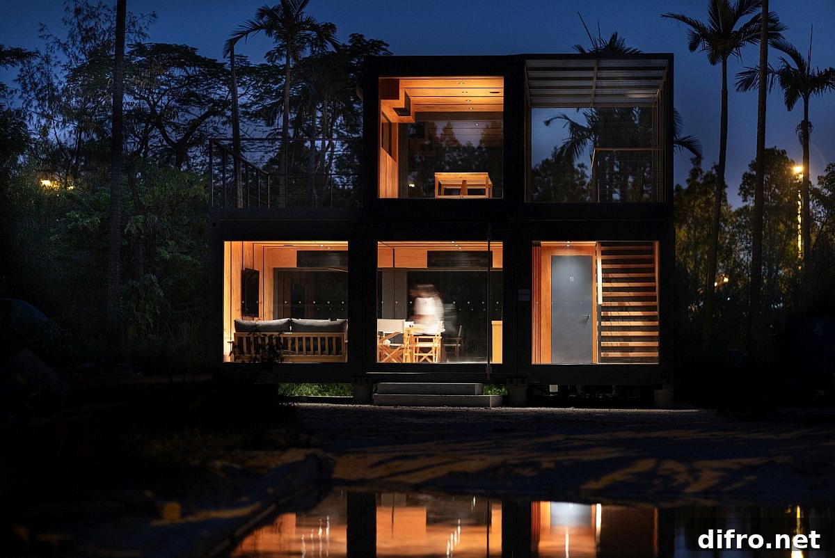 Natural greenery and waterbody around shipping container unit