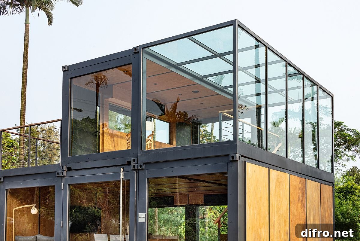 Wood and glass soften the visual impact of the steel frame brought in by the shipping container units