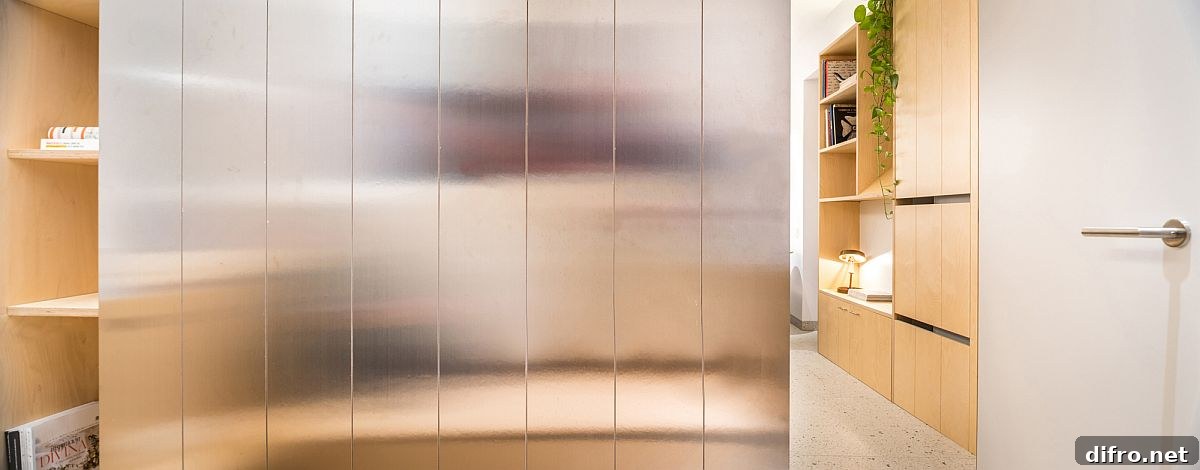 Attractive steel wall cabinet also reflects light inside the apartment