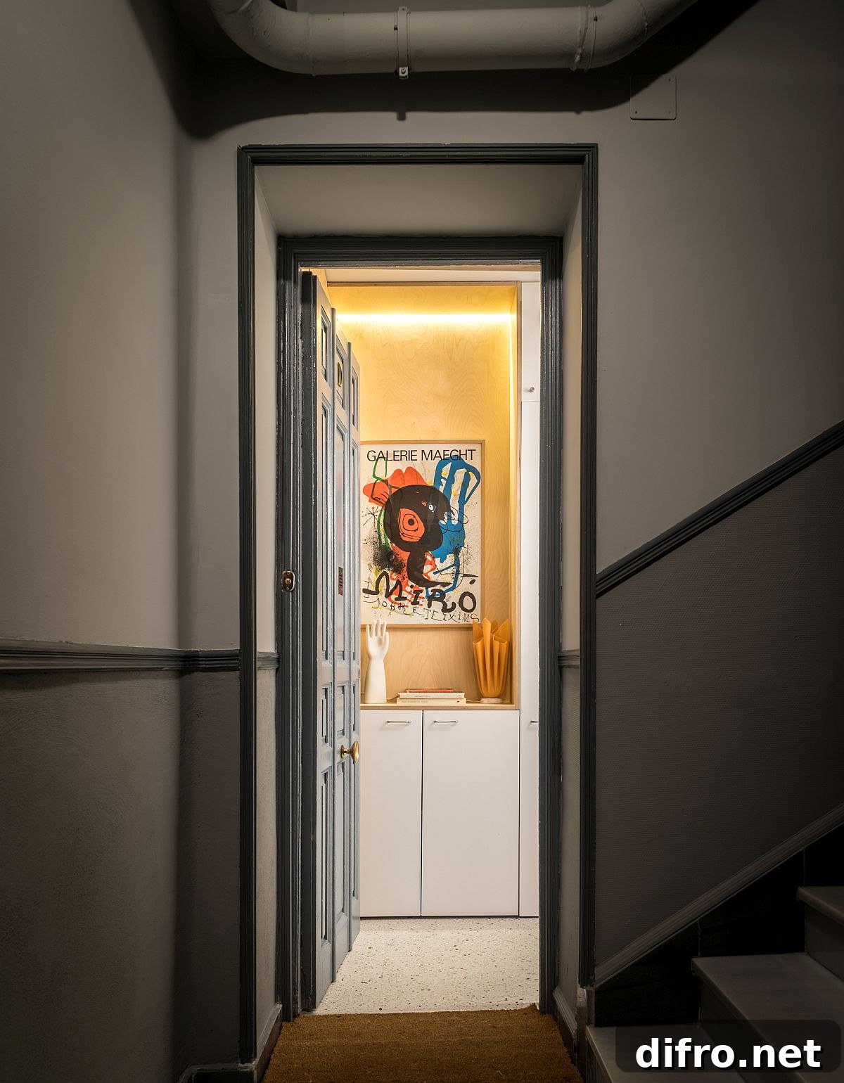 Two basement level units turned into light-filled breezy modern apartment in white and wood