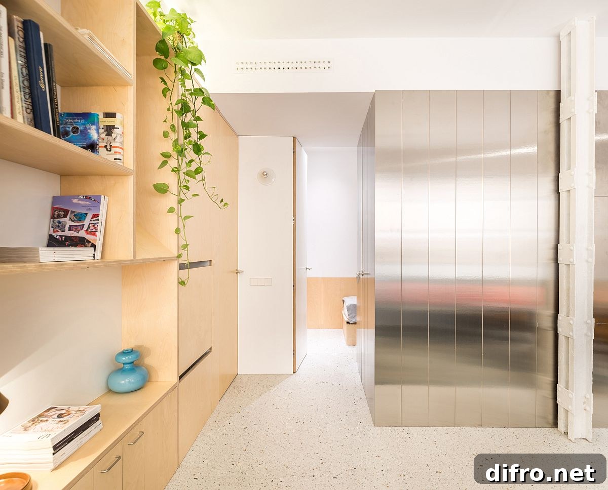 A touch of greenery adds color and charm to an otherwise neutral apartment living room
