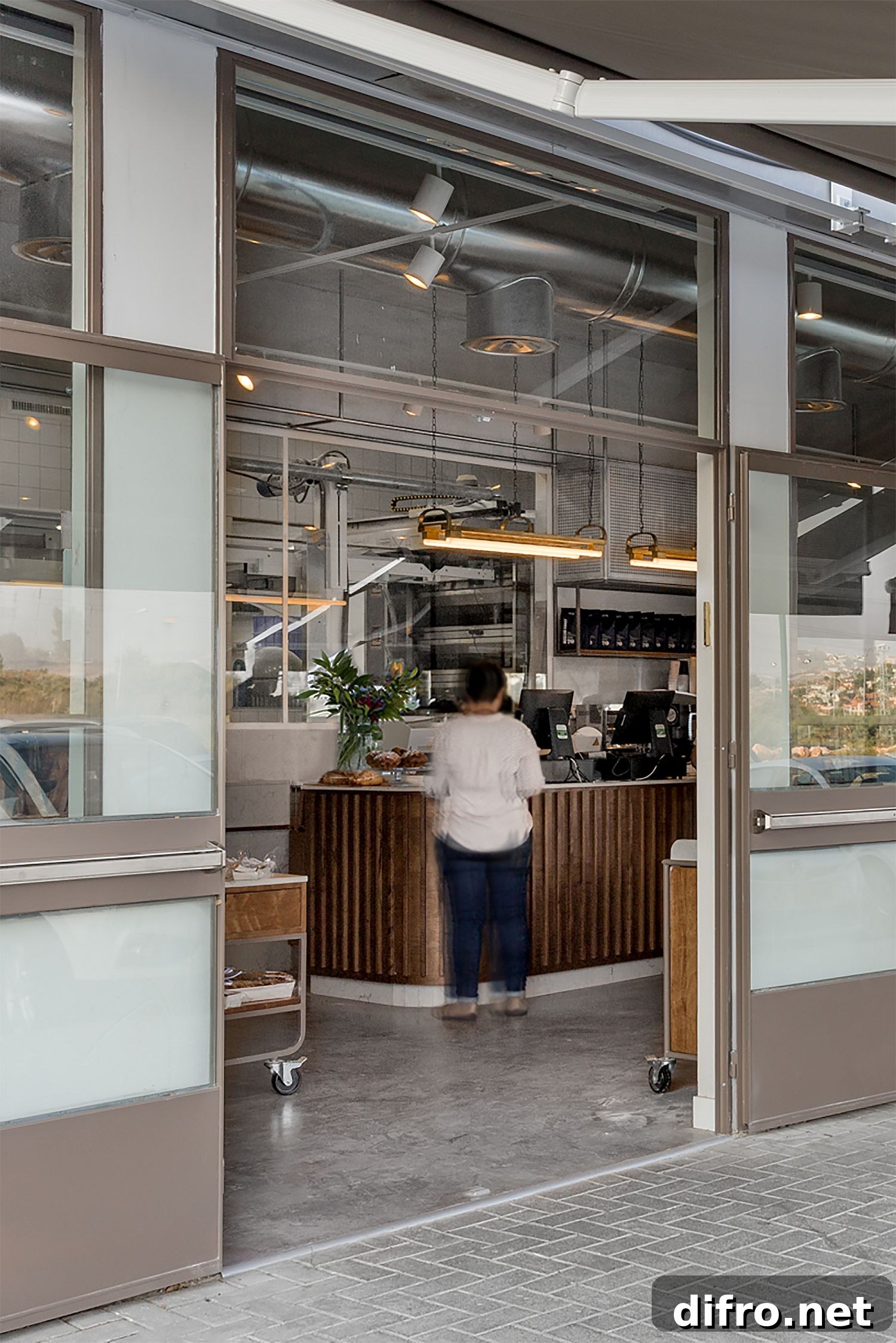 Concrete, metal and polished finishes find space next to one another inside the bakery
