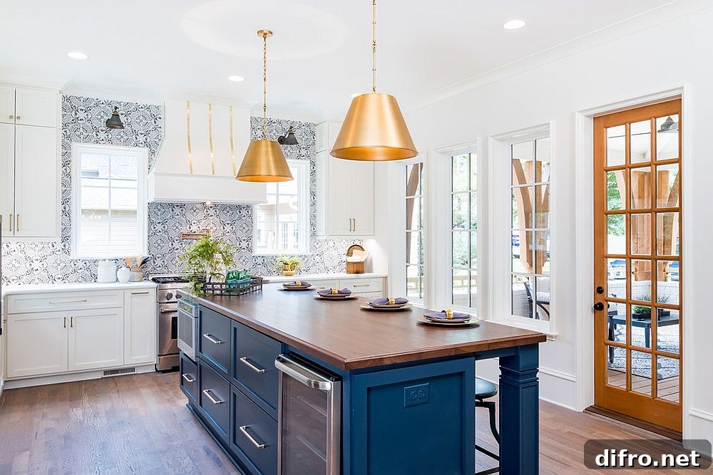 Transitional kitchen with blue accents and metallic pendants