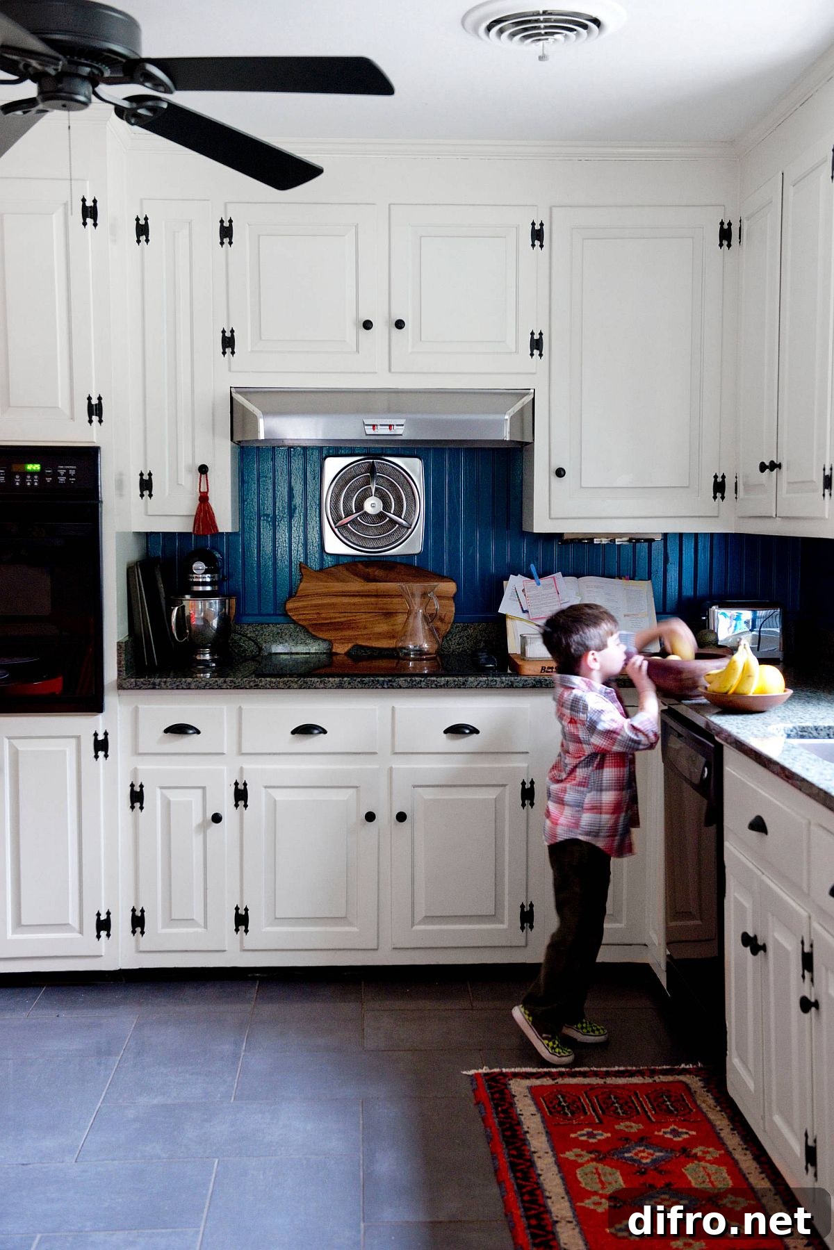 Modern eclectic kitchen with a blue backsplash