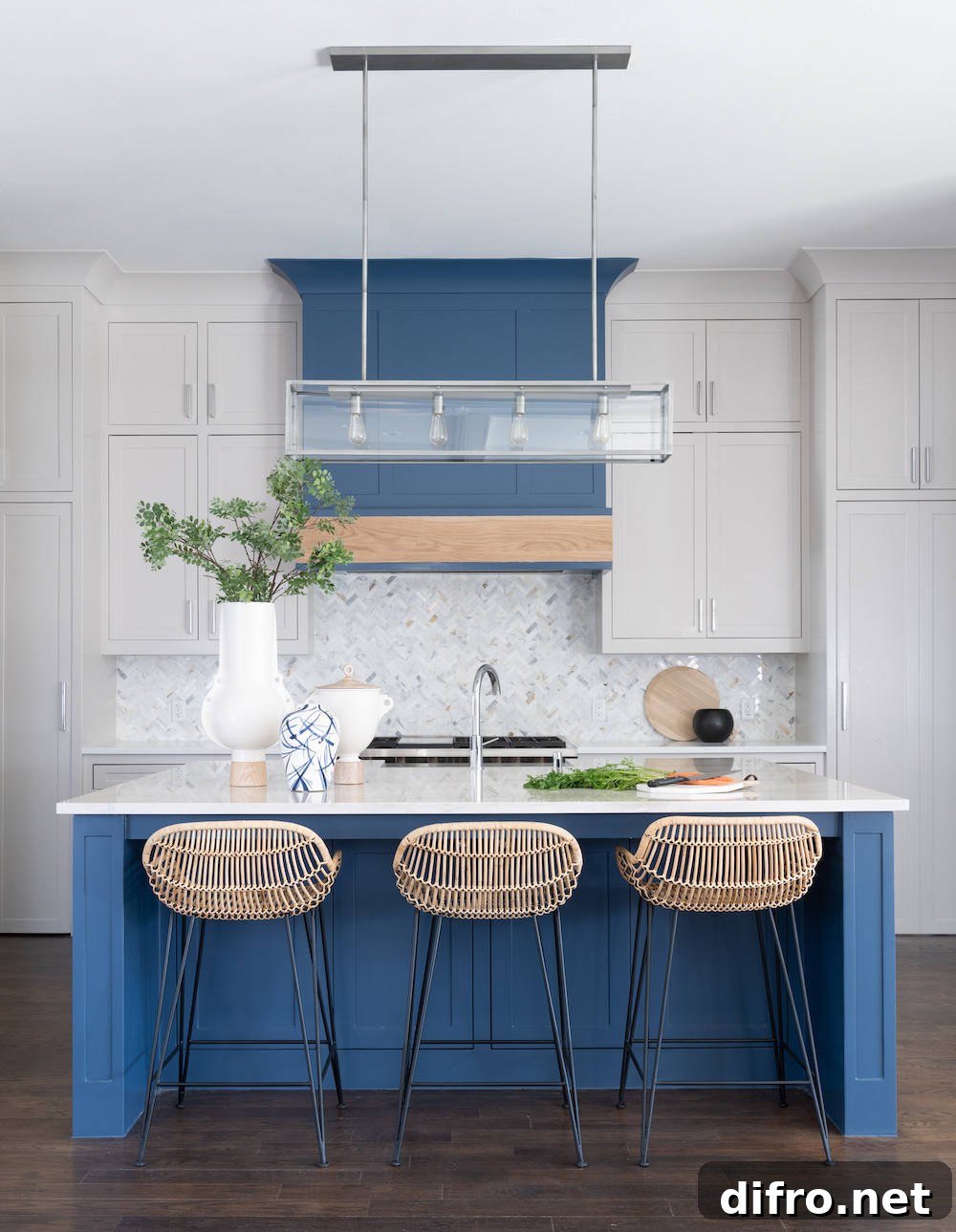 Kitchen with blue island and matching hood
