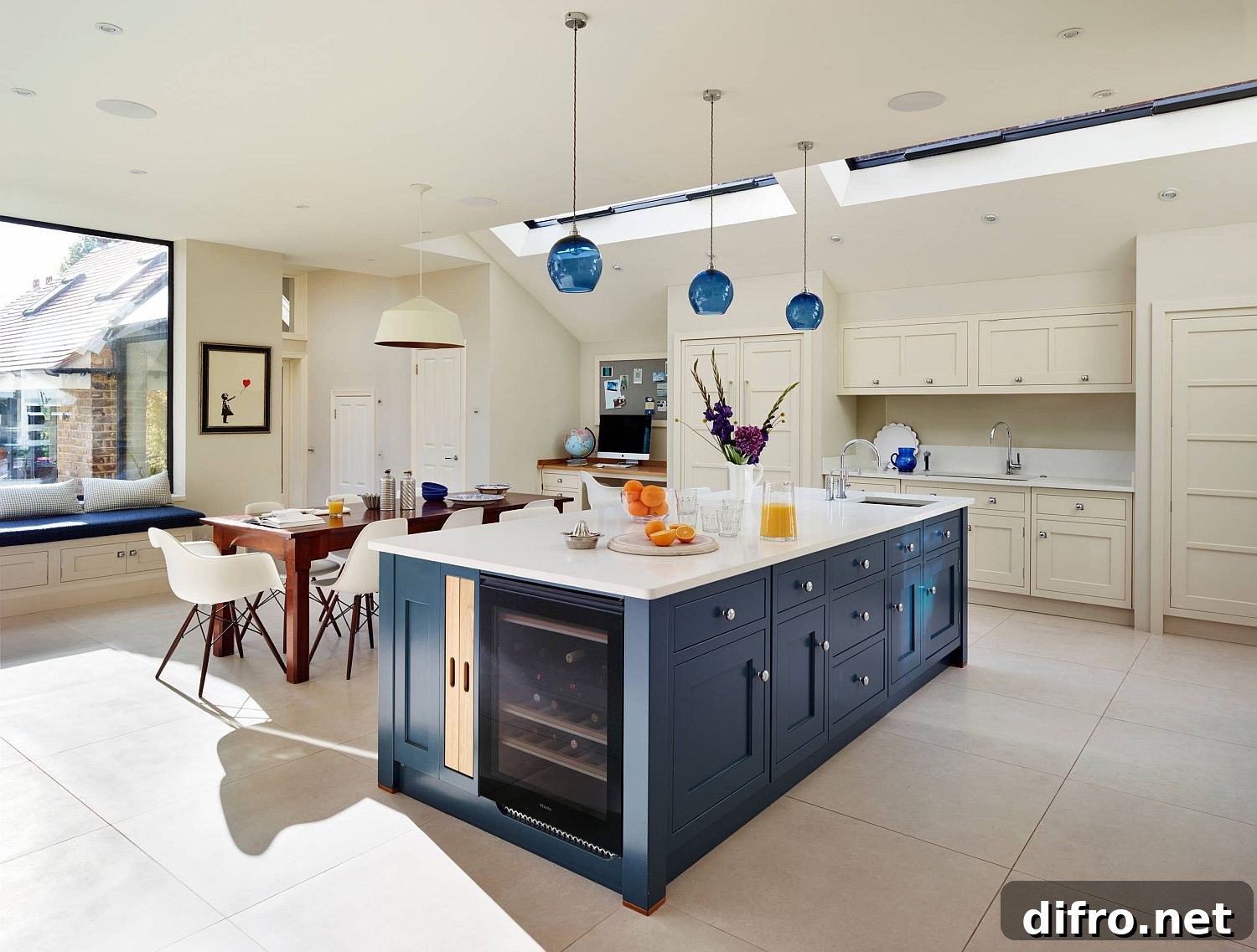 White kitchen with blue island and wine storage