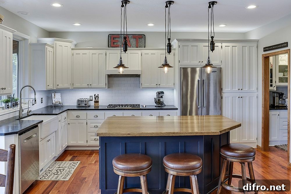 White enamel cabinets with a bright blue island