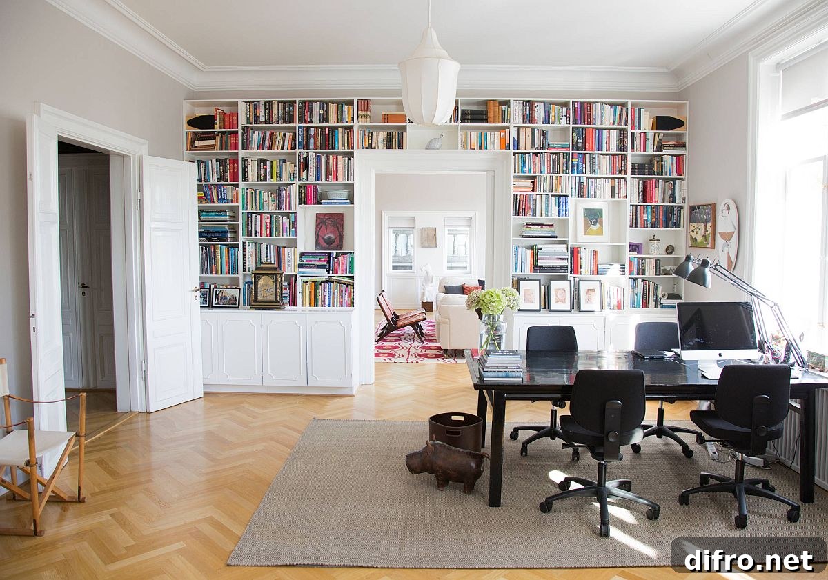 Open white shelves with closed cabinets around a doorway in a home office