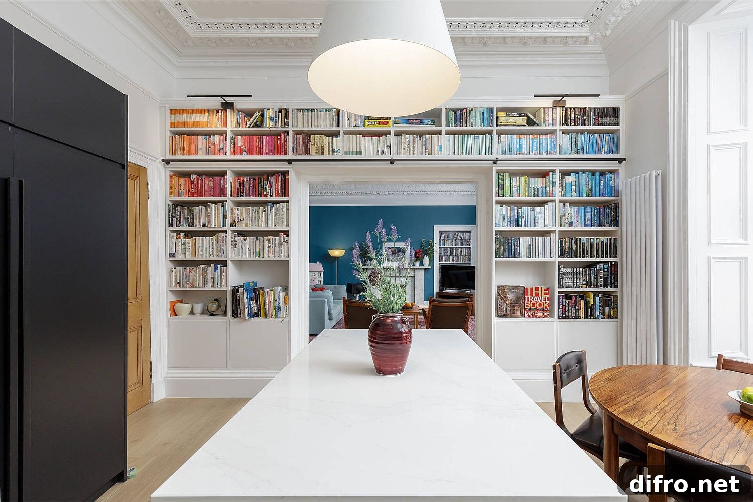 Ombre bookshelves in a dining room and kitchen