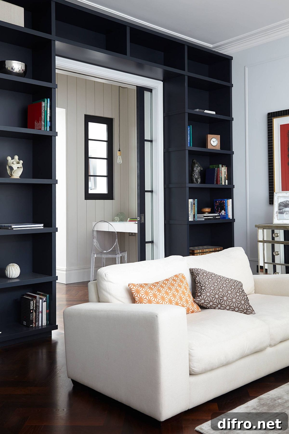Dark open shelves wrapped around a doorway