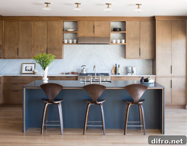 Kitchen with natural wood cabinetry and white marble countertop